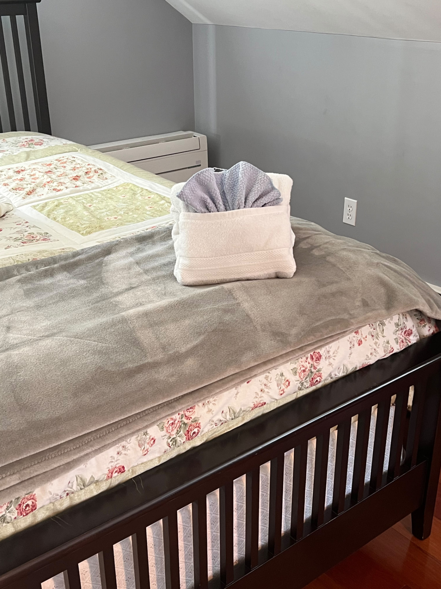 Bedroom — freshly made bed, folded towels by MD Cleaning Services LLC