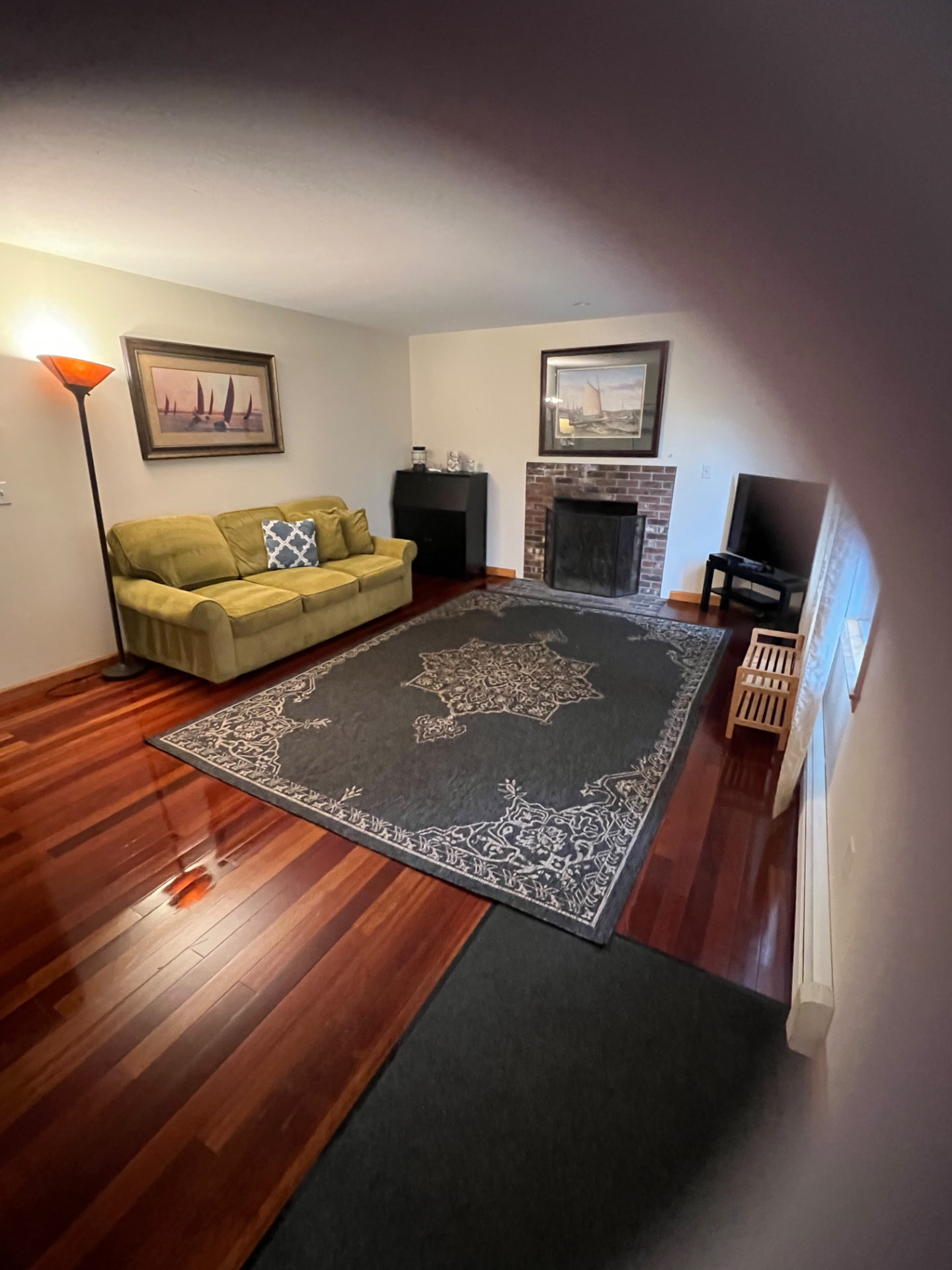 Living room — shining floors around the fireplace by MD Cleaning Services LLC