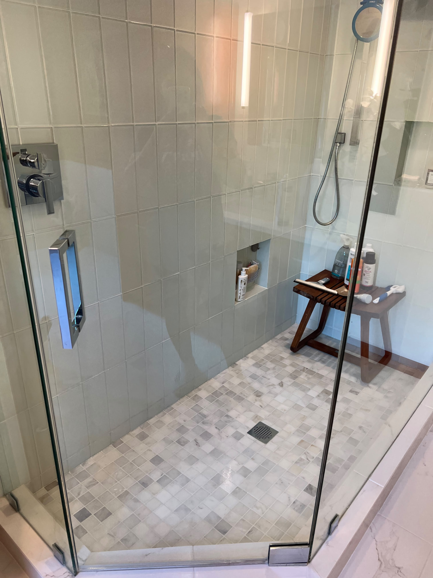 Walk-in shower — sanitized tile, no water spots by MD Cleaning Services LLC